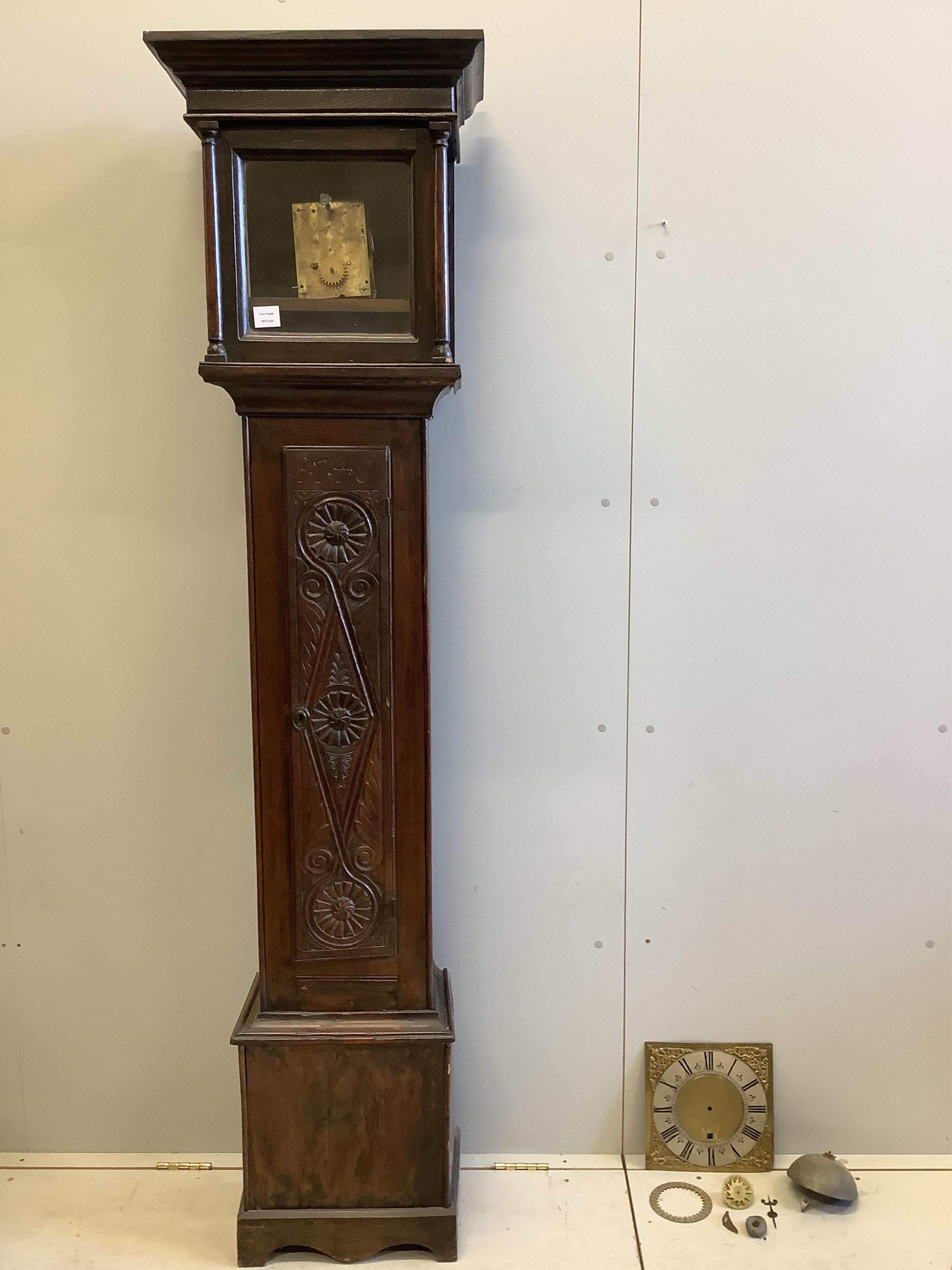 An 18th century carved oak thirty hour longcase clock, movement dis-assembled, height 204cm